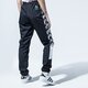 dámske nohavice PUMA NOHAVICE  TFS OG AOP PANTS 59706001 farba čierna