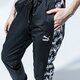 dámske nohavice PUMA NOHAVICE  TFS OG AOP PANTS 59706001 farba čierna