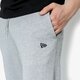 pánske nohavice NEW ERA NOHAVICE  ESSENTIAL TRK PANT NE GRY 11419429 farba sivá